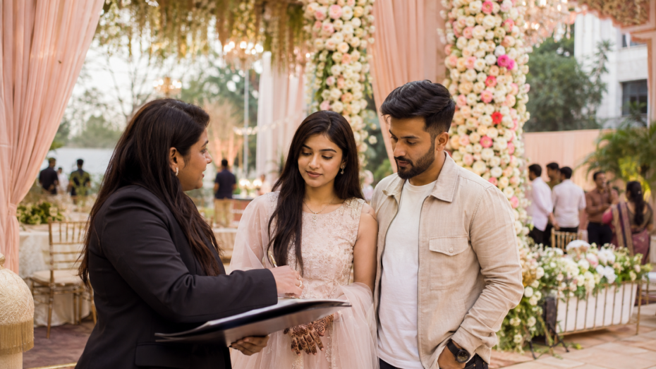Wedding planner in Bangalore discussing wedding plans with a couple